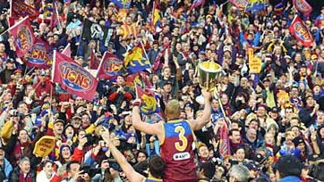 Michael Voss celebrates with Brisbane fans