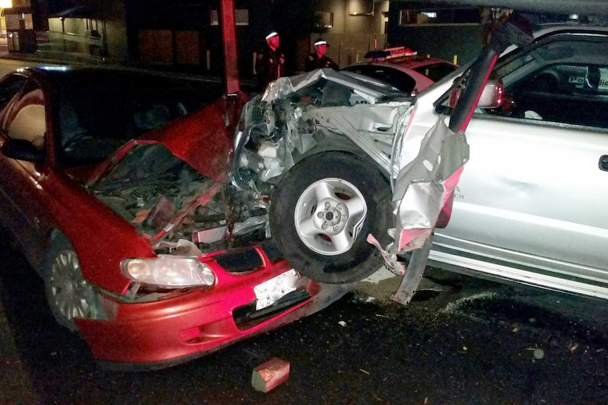 An allegedly stolen silver Nissan ute crashed into a parked car.