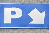 A blue parking sign