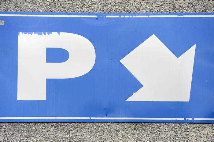 A blue parking sign