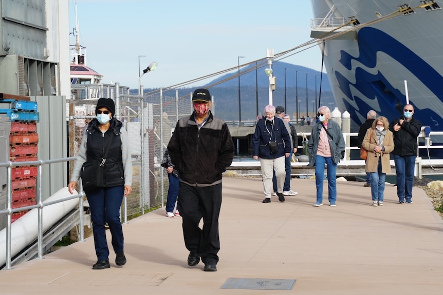 Passengers disembark a cruise ship