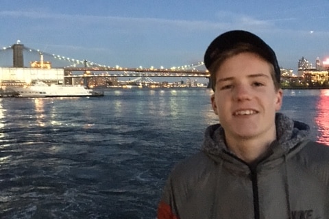 James Browning stands in front of a harbour