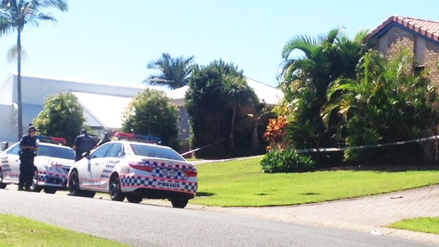 Police outside a house in Remick Street at Stafford Heights on Brisbane's northside, where a woman in her 60s has died