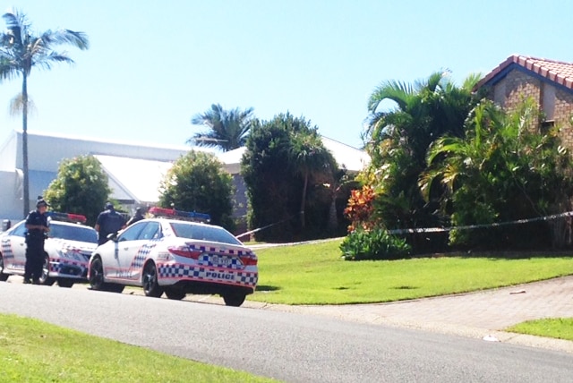 Police outside a house in Remick Street at Stafford Heights on Brisbane's northside, where a woman in her 60s has died