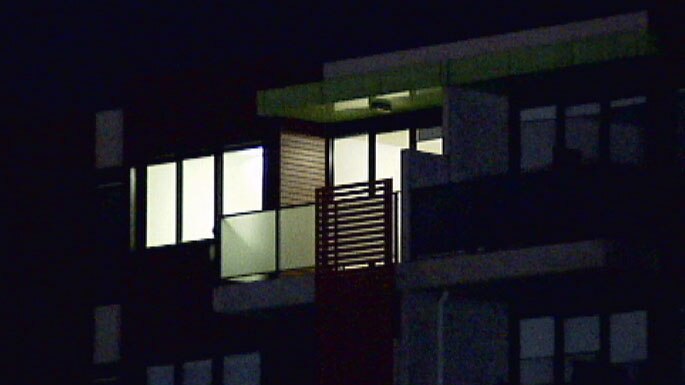 Exterior of Brunswick West flat with lights on inside