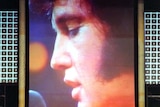 Elvis Presley on a large video screen