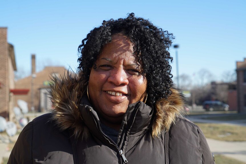 Cheryl Johnson smiles as she stands in front of the camera in Chicago