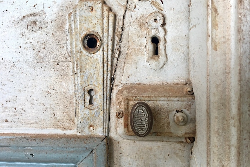 An old door lock and keyhole