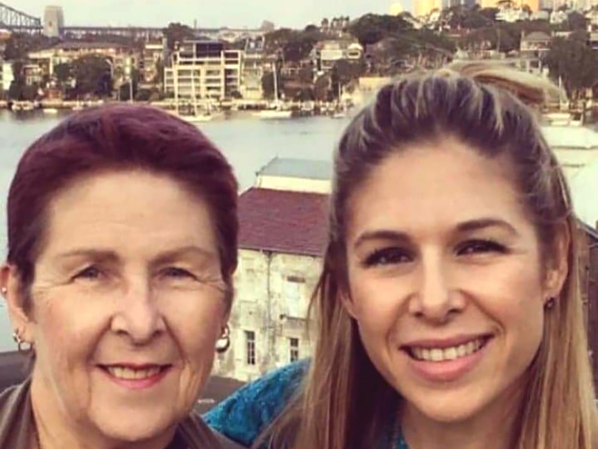 A mother and daughter-selfie with Sydney Harbour in the background