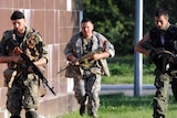 Pro-Russian militants run near their checkpoint in the eastern Ukrainian city of Slaviansk.