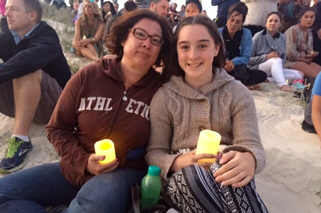 Mother and Daughter Nicole and Maddison attend a candle light vigil on the Gold Coast for domestic violence