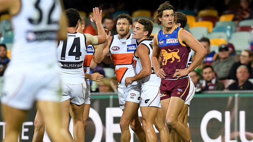 Giants players celebrate a goal against Brisbane Lions at the Gabba on June 23, 2018.