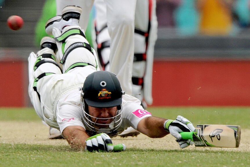 Ricky Ponting dives to make his ground and reach his century on day two of the second Test.