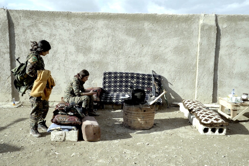 Members of the Kurdish female military force, the YPJ, serve on the frontline.