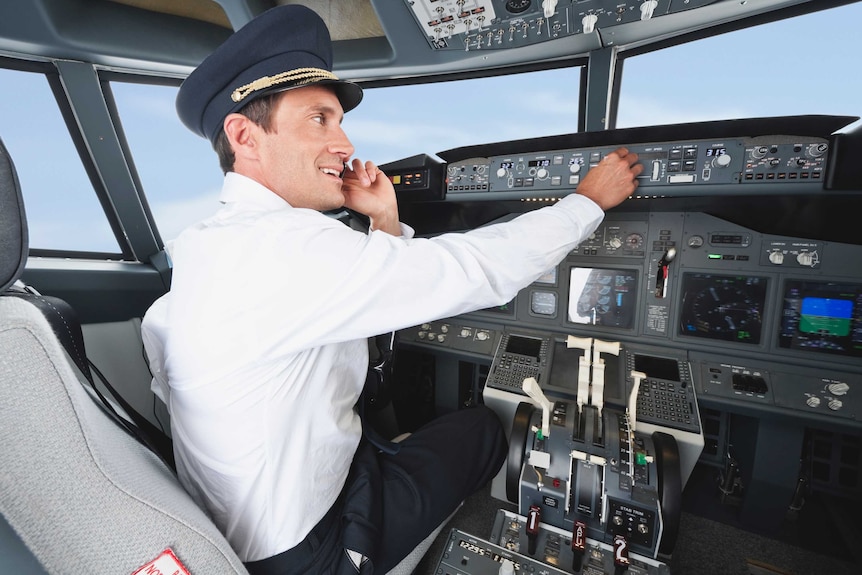 Airline pilot using mobile phone while flying