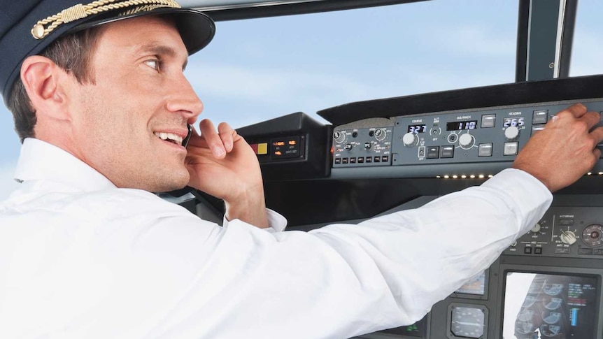 Airline pilot using mobile phone while flying