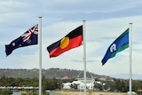 The Australian, Aboriginal and Torres Strait flags fly in Canberra.