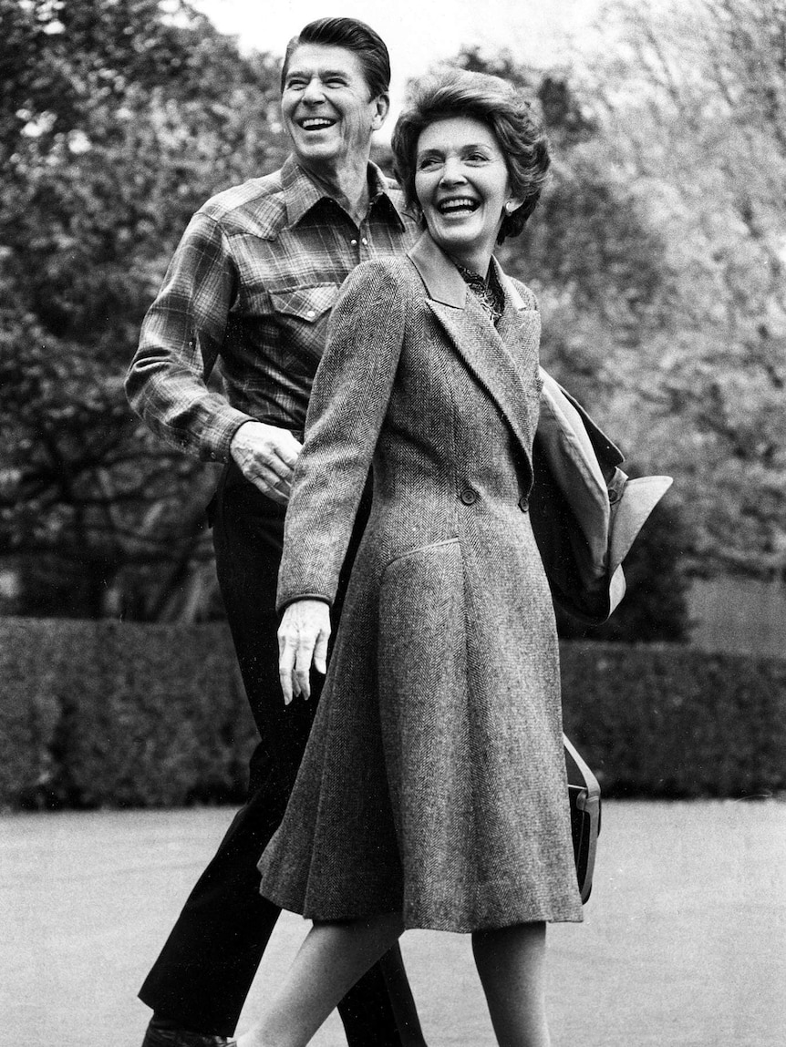 Ronald Reagan and Nancy Reagan smile in black and white photo