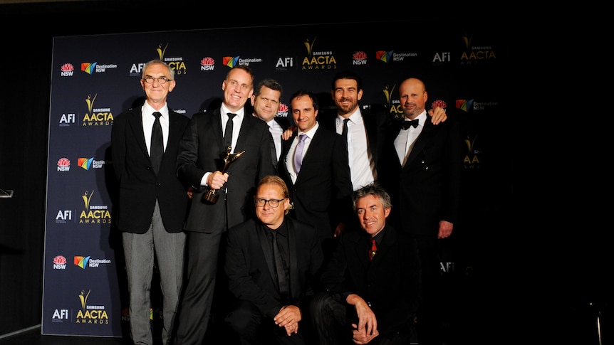 The cast and crew of Red Dog speak to media after accepting their AACTA Award for Best Film.