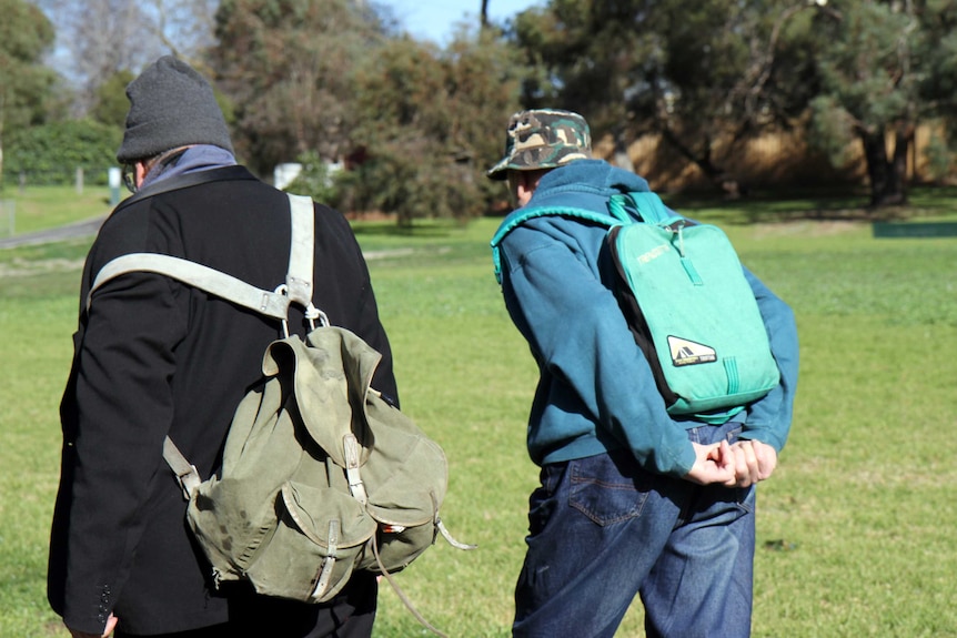 Two men walking.