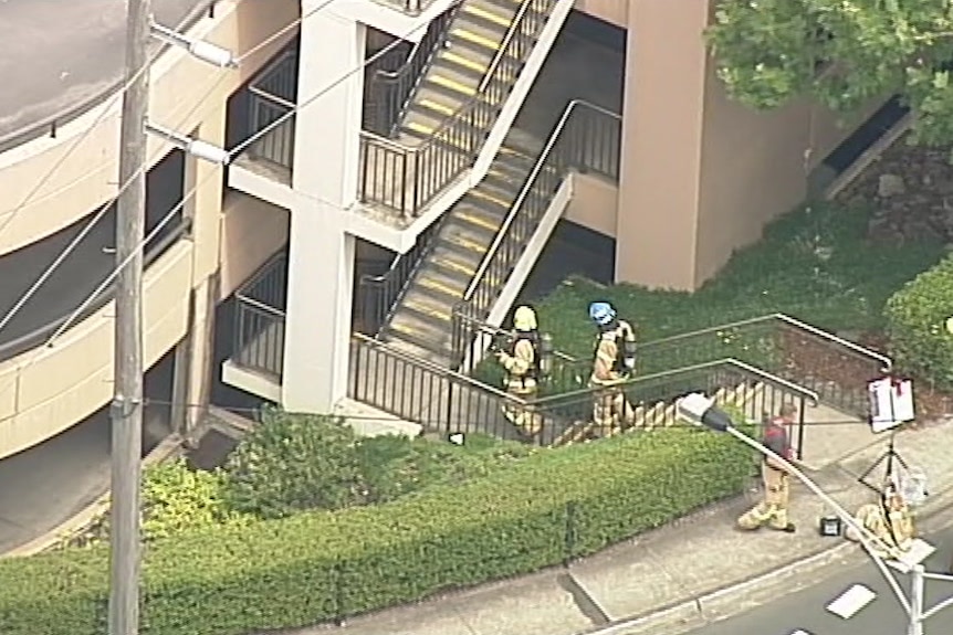 An aerial view showing firefighters entering a car park at Chadstone shopping centre.