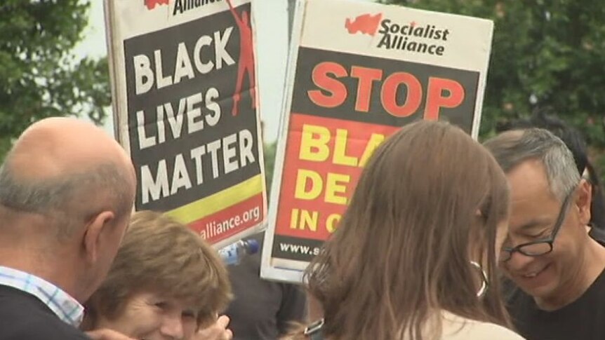 People march at 'Invasion Day, no pride in genocide' rally in Redfern
