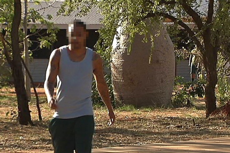 A prisoner walks in the grounds at the West Kimberley regional prison