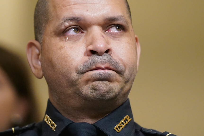 US Capitol police officer Gonell cries as he watches a video of the insurrection during the House select committee hearing.