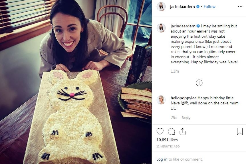 A smiling Jacinda Ardern pictured with a cake in the shape of a rabbit covered in coconut.