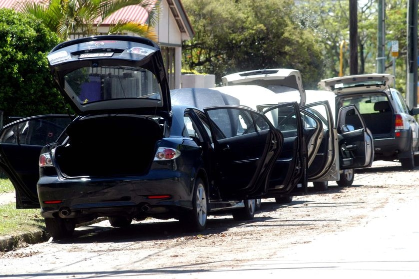 A line of cars get an airing at Auchenflower, Brisbane, after the street flooded