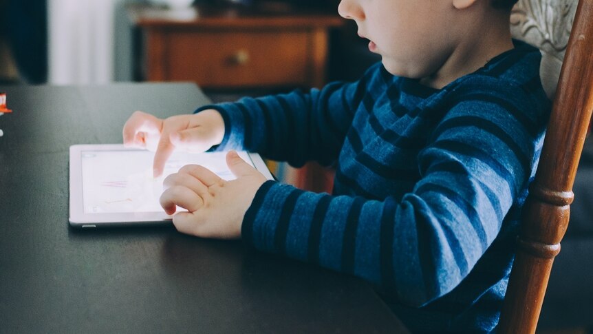Child using iPad for story about advice for being the best advocate for your child