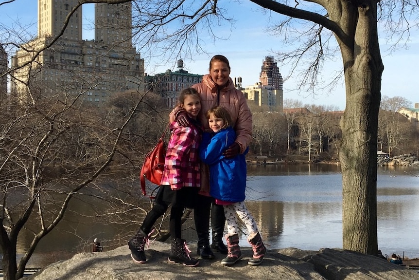 Margaret Ambrose hugging daughters Greta and Rori