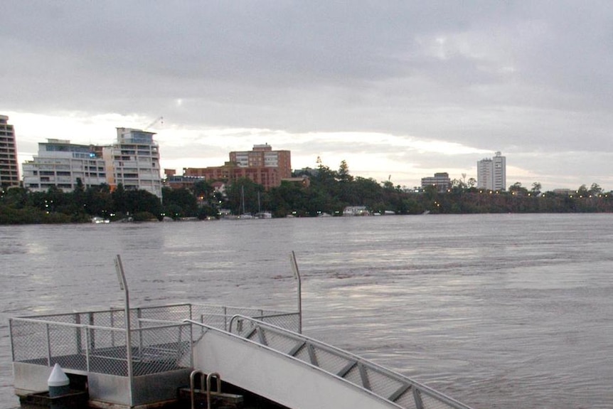 A crowd of people gather at the Riverside complex in the Brisbane CBD