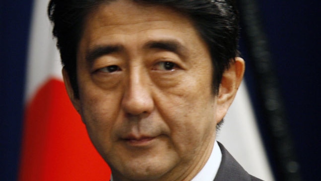 Shinzo Abe is seen looking gloomy.