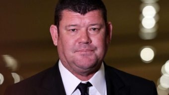 A portrait of James Packer in a suit.