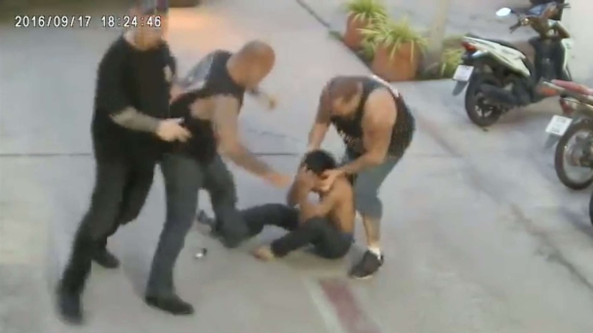 A still from CCTV footage of three Hells Angels members assaulting a man.