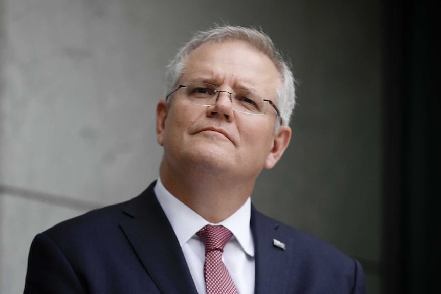 Prime Minister Scott Morrison listens to a question.