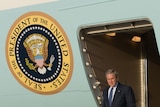 Final farewell: George W Bush steps off of Air Force One for his fourth and final visit to Iraq.