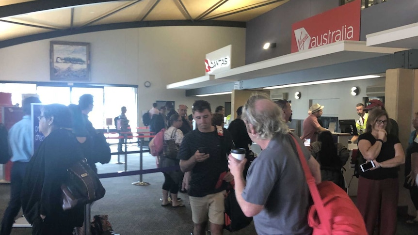 Passengers in an airport terminal.