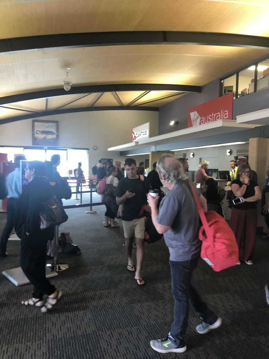 Passengers in an airport terminal.