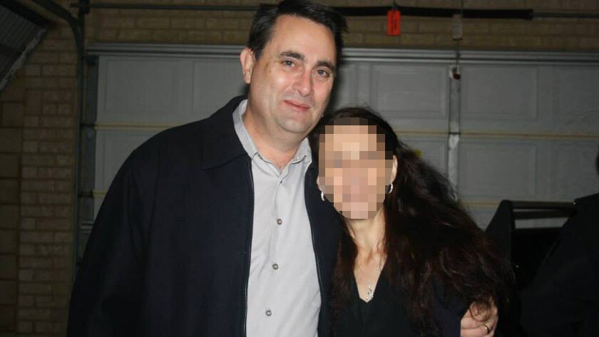 Bradley Robert Edwards standing next to a woman with her face pixellated.
