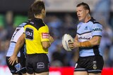 Paul Gallen has a talk to the ref on field during a match against the Melbourne Storm