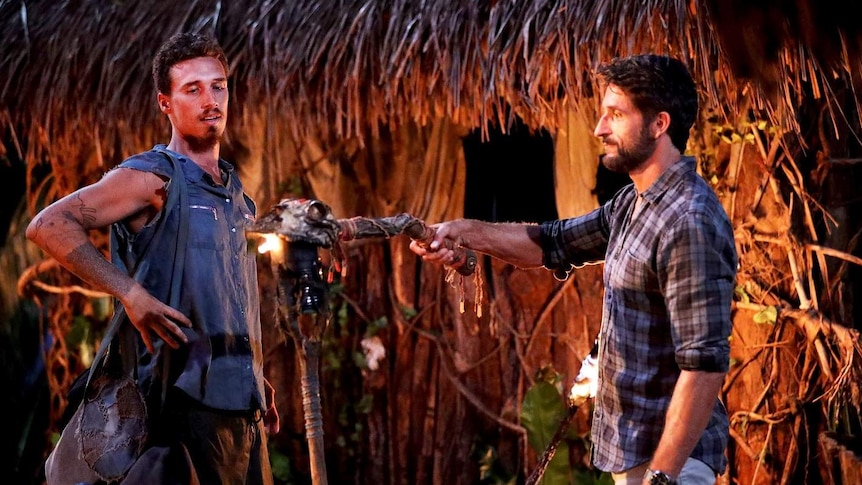 Luke Toki looks shocked as his flame is extinguished by Jonathan LaPaglia