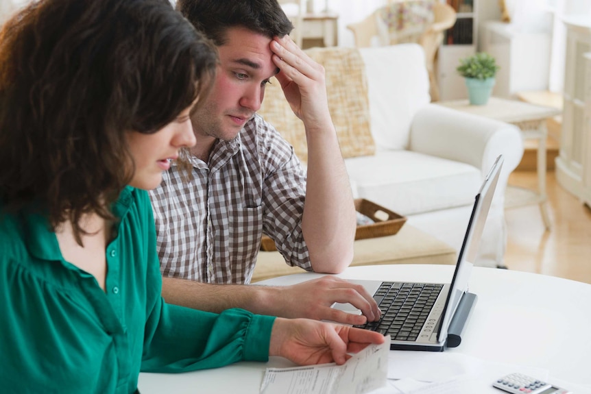 Couple looking stressed.