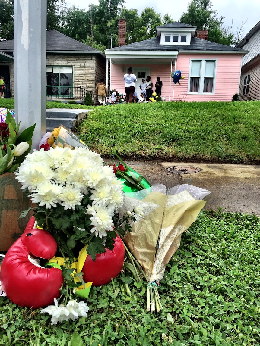 Mourners leave flowers and tributes outside Muhammad Ali's childhood home in Louisville.