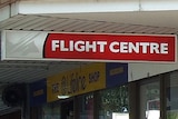 A Flight Centre sign outside some shops