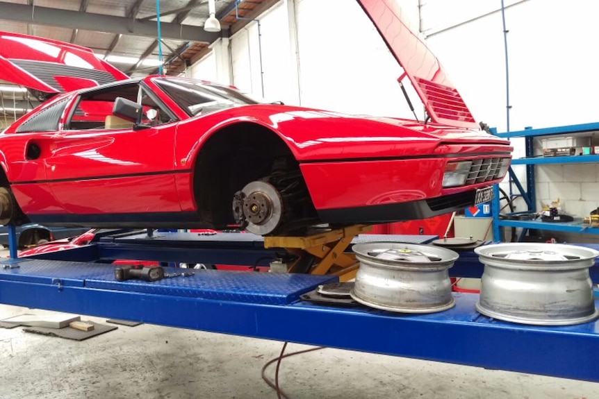 A Ferrari 328 in a workshop