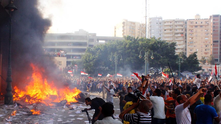 Opponents of president Morsi burn the contents of an office in Alexandria on June 28, 2013