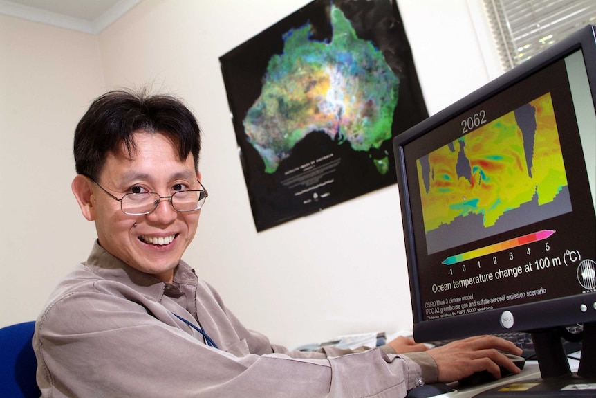 Professor Wenju Cai at his desk