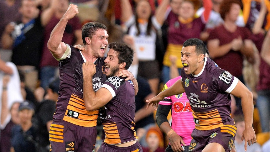 Corey Oates celebrates winning try against Penrith